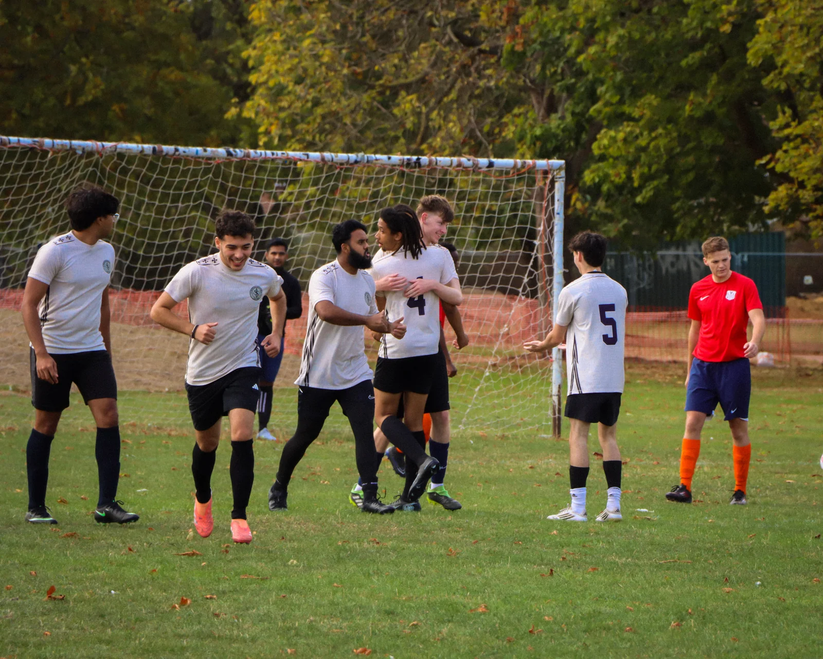 Southgate Spartans players celebrating together in front of the goal